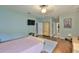 Bright bedroom with wood floors and access to a bathroom at 11154 Creek Haven Dr, Riverview, FL 33569