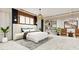 Spacious bedroom with a large bed, stylish decor, and ample space at 8936 Williams Rd, Seffner, FL 33584