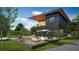 Contemporary home with a pool, deck, and outdoor seating area at 8936 Williams Rd, Seffner, FL 33584