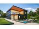 Modern home showcasing a pool, deck and landscaped yard at 8936 Williams Rd, Seffner, FL 33584