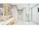 Spa-like bathroom featuring double sinks, a walk-in shower, and modern finishes at 8936 Williams Rd, Seffner, FL 33584