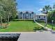 House with manicured lawn and private dock access at 2509 N Dundee St, Tampa, FL 33629