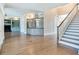 Built-in wet bar with granite countertop and glass shelving at 2509 N Dundee St, Tampa, FL 33629