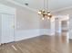 Formal dining room with hardwood floors and modern chandelier at 2509 N Dundee St, Tampa, FL 33629