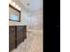 Bathroom features dark brown vanity, tile flooring and shower/tub combo at 2509 N Dundee St, Tampa, FL 33629