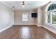 Spacious bedroom with hardwood floors, large windows, and ceiling fan at 2509 N Dundee St, Tampa, FL 33629