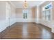 Formal dining room with hardwood floors and wainscoting at 2509 N Dundee St, Tampa, FL 33629