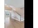 Elegant staircase with hardwood floors and white railing at 2509 N Dundee St, Tampa, FL 33629