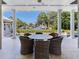 Covered patio with outdoor dining set overlooking canal at 2509 N Dundee St, Tampa, FL 33629