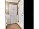 Bathroom with glass shower, white subway tile, and hardwood floors at 2509 N Dundee St, Tampa, FL 33629