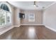 Bright bedroom with hardwood floors and an arched window at 2509 N Dundee St, Tampa, FL 33629