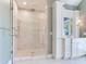 Large walk-in shower with marble tile and glass enclosure at 2509 N Dundee St, Tampa, FL 33629