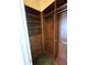 Large walk-in closet with shelves and hanging rods at 346 Madeira Cir, St Petersburg, FL 33715