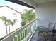 Private balcony overlooking the pool and surrounding landscape at 346 Madeira Cir, St Petersburg, FL 33715