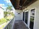 Balcony overlooking courtyard with tropical landscaping at 346 Madeira Cir, St Petersburg, FL 33715