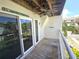 Private balcony with ceiling fan, sliding door, and partial view at 346 Madeira Cir, St Petersburg, FL 33715