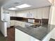 Kitchen with granite countertops and stainless steel appliances at 346 Madeira Cir, St Petersburg, FL 33715