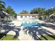 Inviting community pool with lounge chairs and lush landscaping at 346 Madeira Cir, St Petersburg, FL 33715