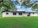 Ranch-style home with a newly landscaped yard at 7301 Pierce Harwell Rd, Plant City, FL 33565