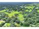 Aerial view of a large rectangular lot surrounded by trees and other houses at 7301 Pierce Harwell Rd, Plant City, FL 33565