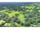 Aerial view of a large rectangular lot surrounded by trees and other houses at 7301 Pierce Harwell Rd, Plant City, FL 33565