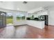 Open concept kitchen with island and stainless steel appliances at 7301 Pierce Harwell Rd, Plant City, FL 33565