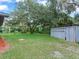 Large backyard with mature trees and a storage shed at 7301 Pierce Harwell Rd, Plant City, FL 33565