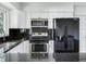 Updated kitchen with stainless steel appliances and granite countertops at 7301 Pierce Harwell Rd, Plant City, FL 33565
