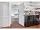 Bright laundry room, washer, dryer, built-in shelving and storage at 7301 Pierce Harwell Rd, Plant City, FL 33565