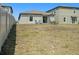 Spacious backyard with grassy area and privacy fence at 16762 Delia St, Wimauma, FL 33598