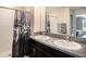 Bathroom with double vanity sinks and a shower/tub combo at 16762 Delia St, Wimauma, FL 33598