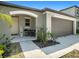 House exterior showcasing walkway and front entrance at 16762 Delia St, Wimauma, FL 33598