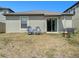 Private backyard with fire pit and seating area at 16762 Delia St, Wimauma, FL 33598