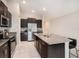 Modern kitchen features stainless steel appliances and granite countertops at 16762 Delia St, Wimauma, FL 33598