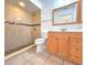 Clean bathroom with a shower, toilet, and vanity at 101 Park N St, St Petersburg, FL 33710