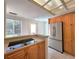 Kitchen with stainless steel appliances and access to backyard at 101 Park N St, St Petersburg, FL 33710