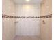 Clean shower with tiled walls and mosaic accents at 101 Park N St, St Petersburg, FL 33710