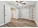 Bedroom with built-in shelving and hardwood floors at 17307 Linda Vista Cir, Lutz, FL 33548