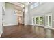 Spacious living room featuring high ceilings and dark hardwood floors at 17307 Linda Vista Cir, Lutz, FL 33548