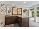 Outdoor kitchen with granite countertop and dark wood cabinets at 17307 Linda Vista Cir, Lutz, FL 33548