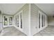 Corner view of a spacious screened porch with French doors at 17307 Linda Vista Cir, Lutz, FL 33548