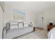 Living area with comfy couch and large beach-themed art at 4215 E Bay Dr # 1701H, Clearwater, FL 33764