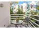 Cozy balcony with a small table and chair, perfect for enjoying the outdoor scenery at 4950 Bayshore Blvd # 13C, Tampa, FL 33611