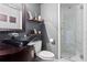 Stylish bathroom featuring a glass shower, floating shelves, unique vessel sink, and modern fixtures at 4950 Bayshore Blvd # 13C, Tampa, FL 33611