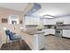 Bright kitchen features white cabinetry, stone countertops, and stainless steel appliances at 4950 Bayshore Blvd # 13C, Tampa, FL 33611