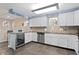 Modern kitchen features granite countertops, stainless steel appliances, and white cabinets for a sleek and clean look at 4950 Bayshore Blvd # 13C, Tampa, FL 33611