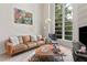 Bright living room featuring a large window, modern décor, comfortable seating, and stylish accents at 4950 Bayshore Blvd # 13C, Tampa, FL 33611