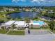 Community pool and clubhouse near waterfront at 4600 Marine Parkway # 104, New Port Richey, FL 34652