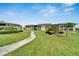 Community featuring manicured lawns, walkways, and a fountain at 4600 Marine Parkway # 104, New Port Richey, FL 34652