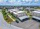 Aerial perspective of condo building, parking, and surrounding neighborhood at 4600 Marine Parkway # 104, New Port Richey, FL 34652